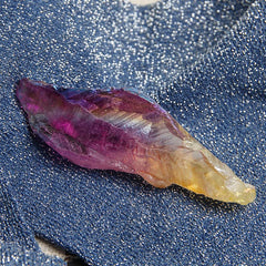 Acxico crystal point closeup shows rainbow hue for crystal work and focus.