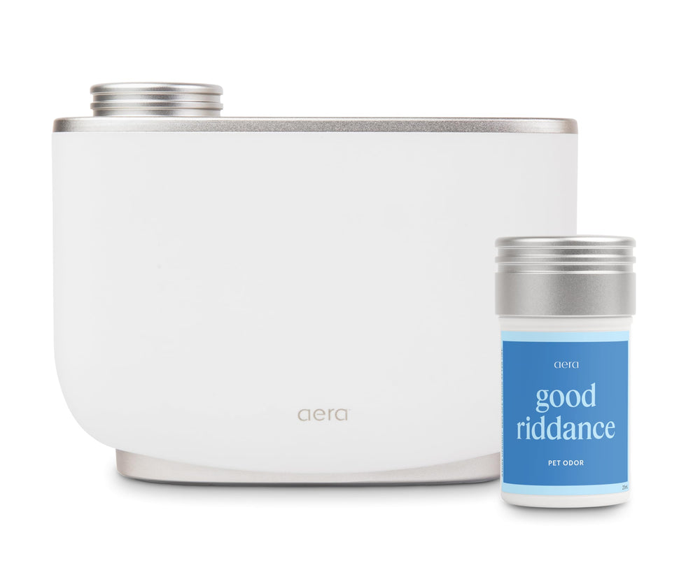 Aera diffuser front view in white, blending with decor for discreet scenting.