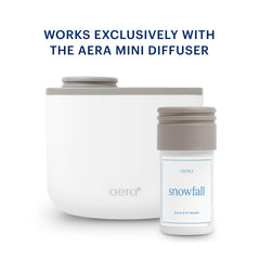 Snowfall refill packaging beside the diffuser for easy home scenting.