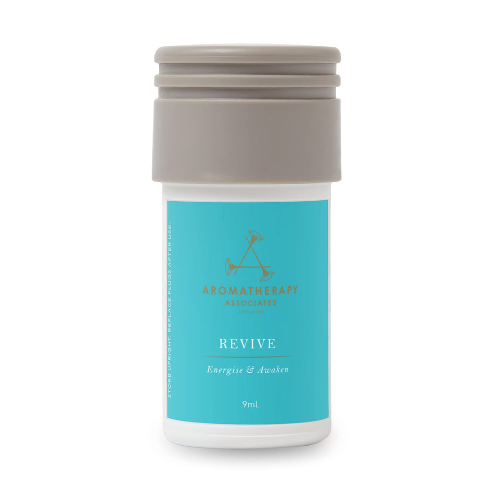 Aera Revive bottle close-up showing juniper berry notes for a refreshed space