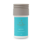 Aera Revive bottle close-up showing juniper berry notes for a refreshed space