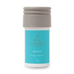 Aera Revive bottle close-up showing juniper berry notes for a refreshed space