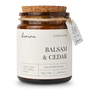 Aeviva scented candle with balsam cedar aroma in amber jar for calming ambience.