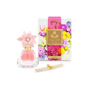 Agraria PetiteEssence diffuser bottle close-up with premium oil and sola flowers.