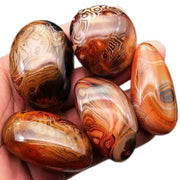 AierCrystal natural agate pebble close-up with banded colors for stylish decor
