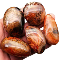 AierCrystal natural agate pebble close-up with banded colors for stylish decor