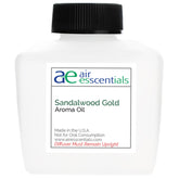 Air Esscentials Sandalwood Gold bottle pour, ideal for diffusers and long-lasting scent