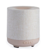Airome Ceramic Essential Oil Diffuser with 100 mL tank releasing a subtle aromatic mist.