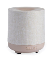 Airome Ceramic Essential Oil Diffuser with 100 mL tank releasing a subtle aromatic mist.
