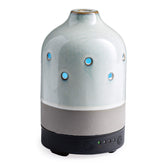 Airome ceramic diffuser front view with glazed concrete finish for a modern decor accent.