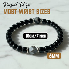 AKDNZ obsidian-tourmaline bracelet detail with glossy beads and grounding energy
