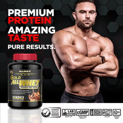 AllMax Gold ALLWHEY powder poured into a shaker for quick post-training mix.