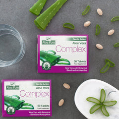 Aloe Pura Colax tablets in hand for daily routine.