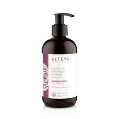 Alteya Organics Bulgarian Rose massage oil bottle pour for soothing skin and calming massage.