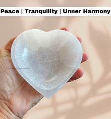 Amazing Gemstone Heart Selenite Bowl resting with crystals to recharge jewelry