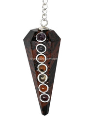 Amazing Gemstone mahogany obsidian pendulum closeup showing faceted hexagonal sides for divination practice