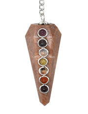 Amazing Gemstone peach moonstone pendulum with hexagonal facets for focused divination sessions.