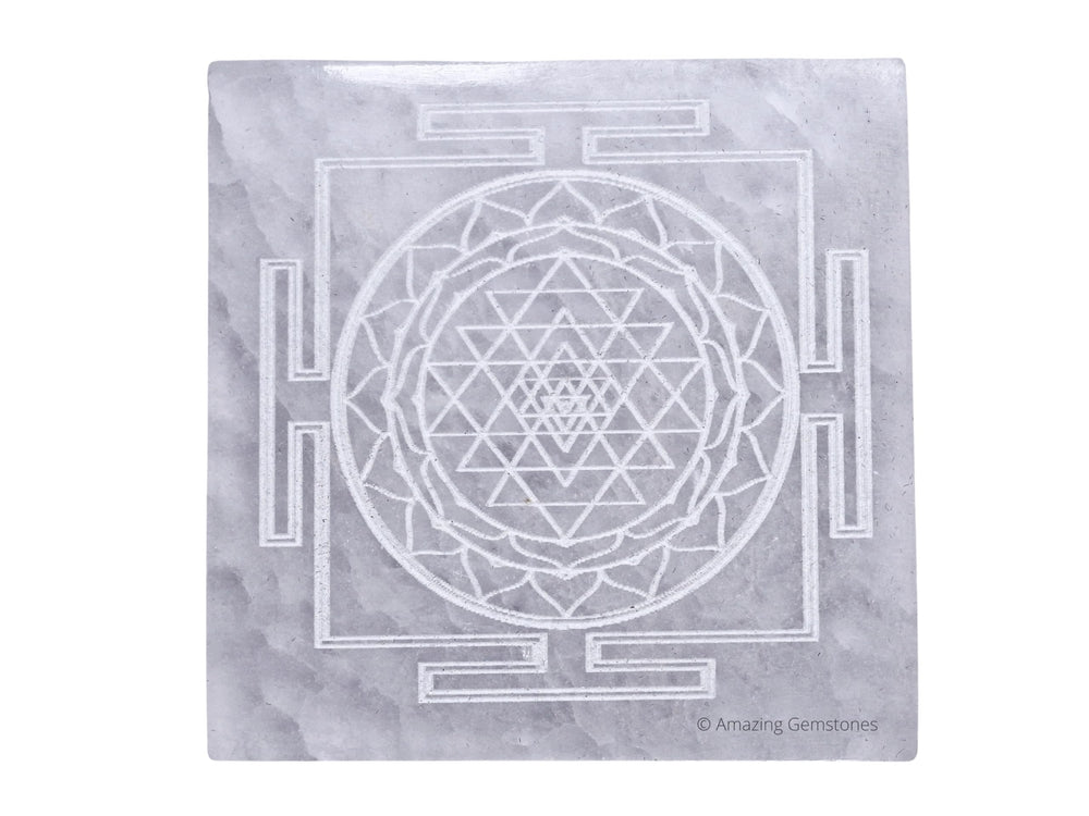 Amazing Gemstone selenite crystal charging plate with Shree Yantra engraving for crystal care on display