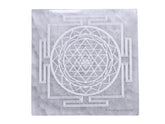 Amazing Gemstone selenite crystal charging plate with Shree Yantra engraving for crystal care on display