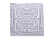 Amazing Gemstone selenite crystal charging plate with Shree Yantra engraving for crystal care on display
