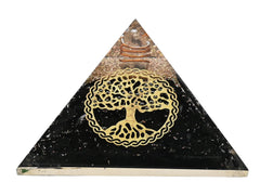 Amazing Gemstone shungite orgone pyramid closeup highlights crystal texture for desk decor.