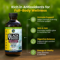 Close-up of the Amazing Herbs label on the black seed oil bottle, emphasizing purity.