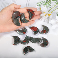 Amogeeli hand-carved moon worry-stone offers smooth relief during stress.