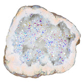 Amogeeli irregular titanium-coated crystal geode cluster on desk for calm ambiance.