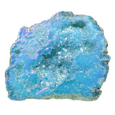 Amogeeli titanium-coated geode cluster glimmers on a desk, adding color and ambience.