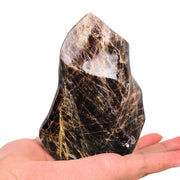AMOYSTONE Black Moonstone Flame Tower on display for calm ambiance and protection