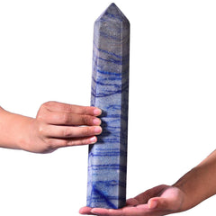 AMOYSTONE blue aventurine wand point close-up highlighting energy focus.