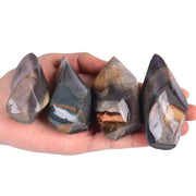 AMOYSTONE Polychrome Jasper Flame Tower front view promotes focus and tranquil energy in your space.