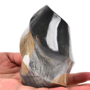 AMOYSTONE Polychrome Jasper Flame Tower on a shelf for focused meditation and energy balance