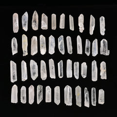AMOYSTONE rough clear quartz points closeup, showcasing natural variety and organic textures.