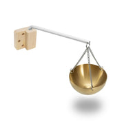 Anbt Sauna Aromatherapy Bowl with gold finish diffuses calm scents in a spa setting.