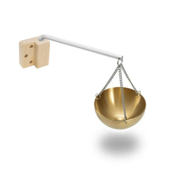Anbt Sauna Aromatherapy Bowl with gold finish diffuses calm scents in a spa setting.