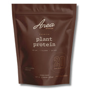 Anea Plant Protein Chocolate tub close-up highlighting premium packaging and powder texture.