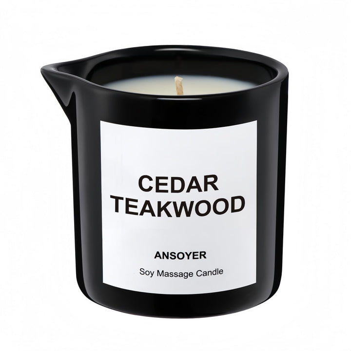 ANSOYER massage oil candle bottle in cedar-teakwood scent for skin hydration.