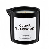 ANSOYER massage oil candle bottle in cedar-teakwood scent for skin hydration.