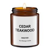 ANSOYER massage oil candle cedar-teakwood lit for warm relaxation.