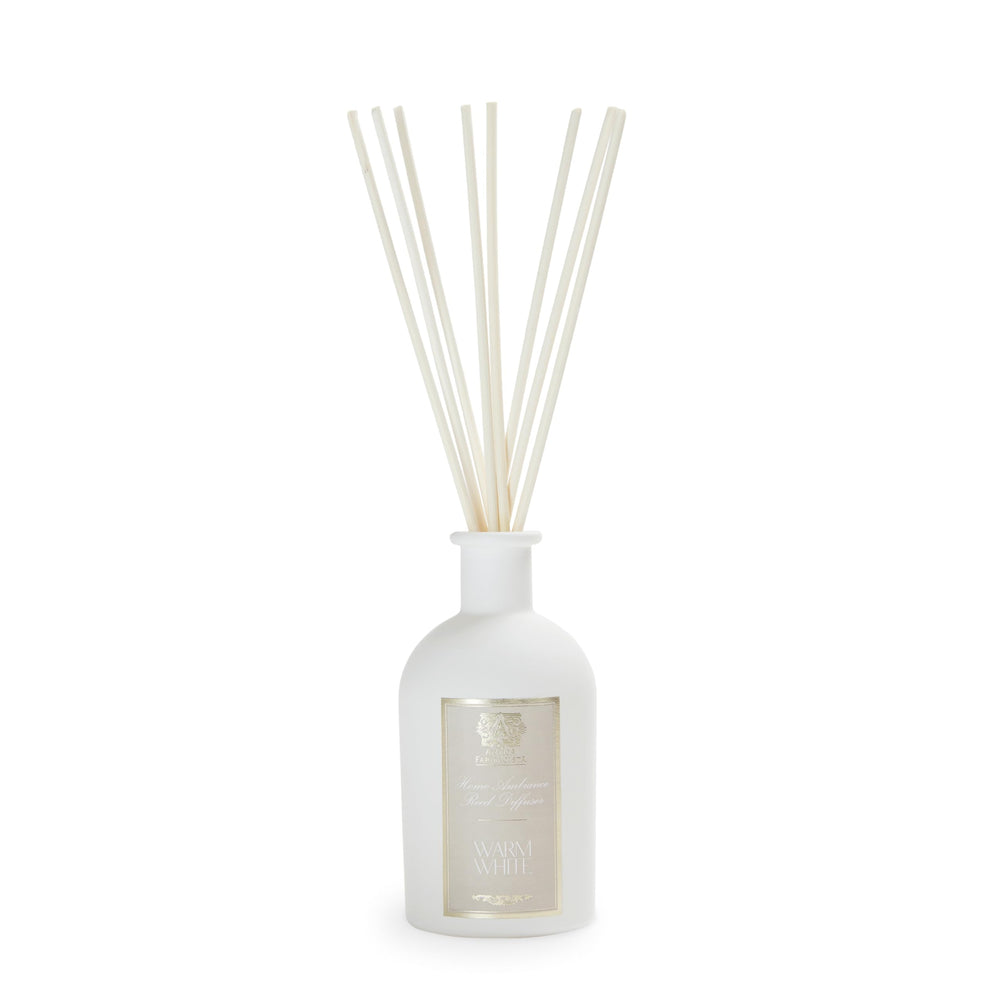 Antica Farmacista warm white diffuser bottle creating a cozy, inviting room.