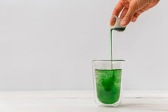 Antler Farms refreshing mint flavor chlorophyll on a spoon and glass