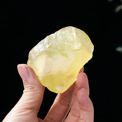 Apengshi Citrine raw stone close-up showing weight and natural irregular shape.