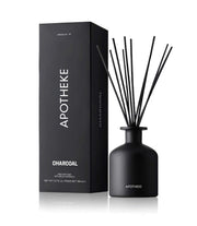 APOTHEKE Charcoal diffuser bottle releasing long-lasting cedarwood and sandalwood aroma.