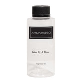 Aroma360 Kiss by a Rose bottle showcasing a luxurious fragrance in a premium setting.