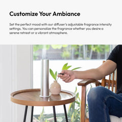 Aroma360 Mini360 diffuser with sleek black design enhances modern decor.