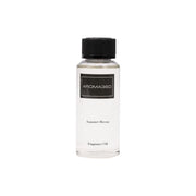 Aroma360 Summer Breeze bottle releasing luxurious fragrance in a living room.