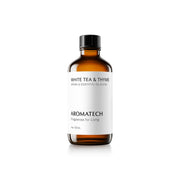 AromaTech White Tea and Thyme bottle beside a diffuser for serene evenings