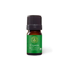 Aromatics International Cypress oil bottle pour for diffusion and a calming ambiance.