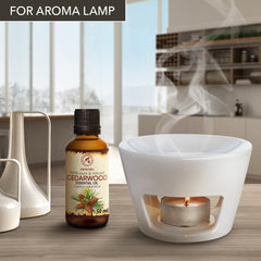Close-up of Aromatika cedarwood oil bottle highlighting purity and natural fragrance.